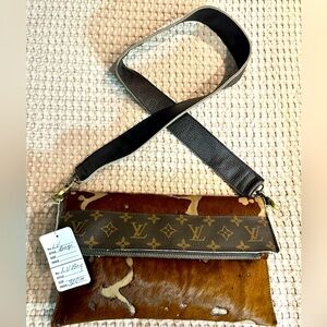 Boutique convertible crossbody/clutch with Louis Vuitton accents. New with tags.